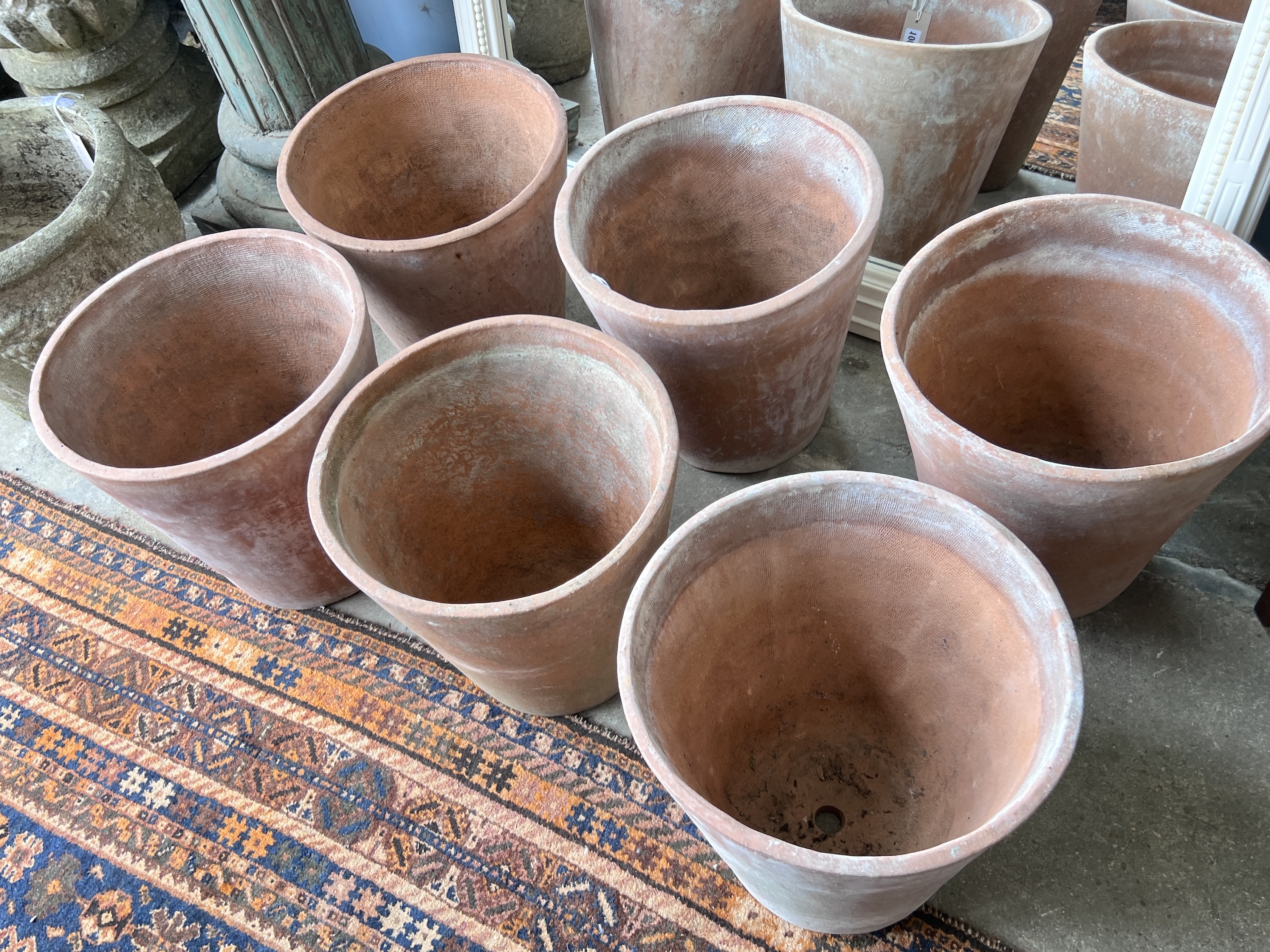 A set of six circular terracotta planters, diameter 35cm, height 36cm